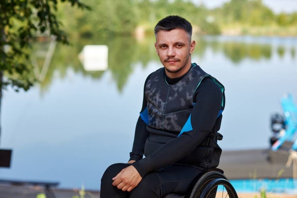 man in a wheelchair wearing adaptive clothing