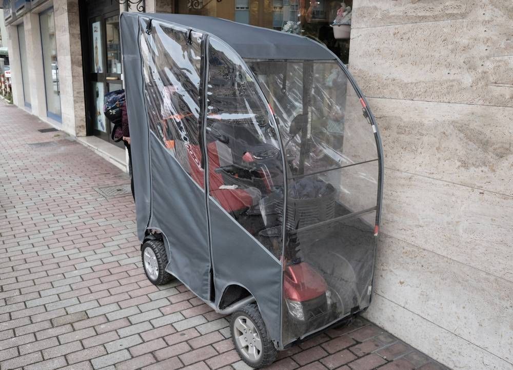 mobility scooter with rainproof cover